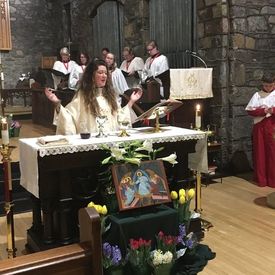 Picture of priest leading worship